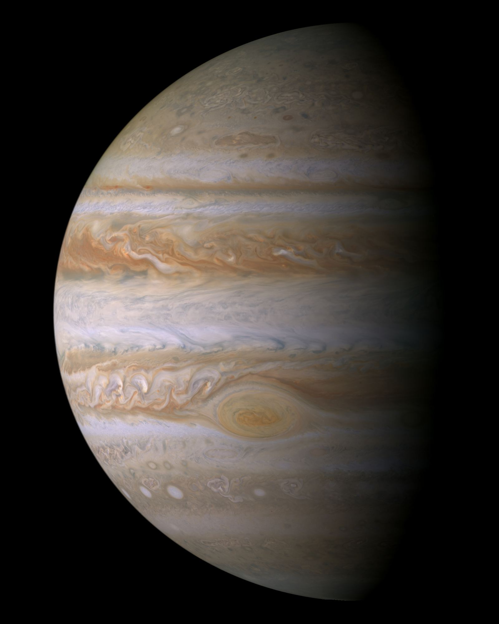 Jupiter's banded globe in cream, tan and brown stripes with the Great Red Spot in the lower half